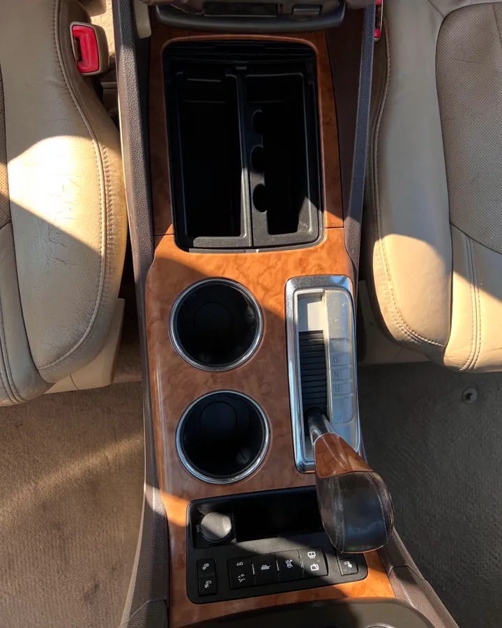 Clean wood-trim center console after detailing